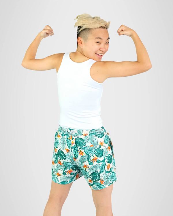 Person flexing wearing long white binder