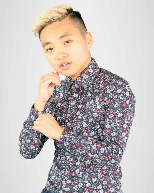 Person wearing shirt over binder