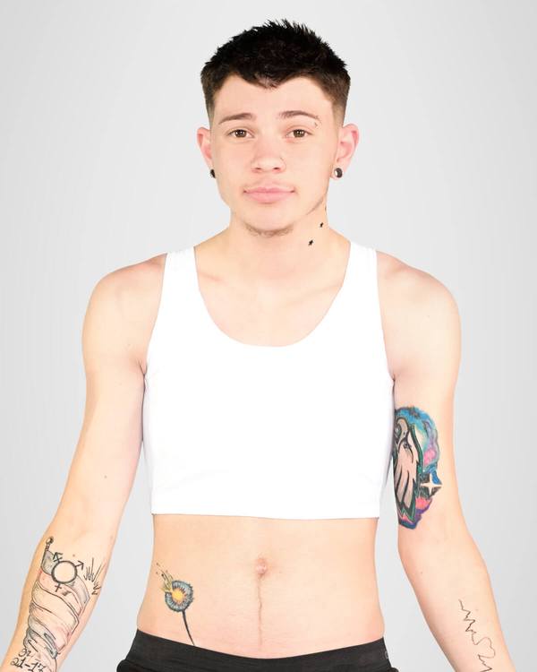 A skinny model wearing Mid Chest Binder