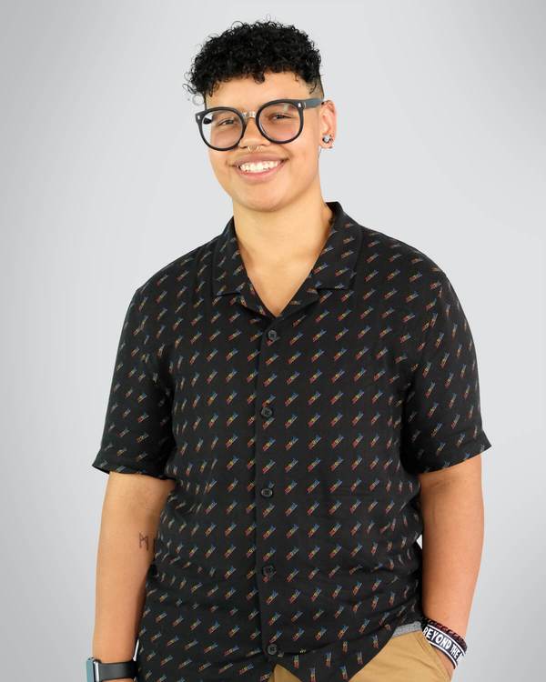 Model wearing a Mid Chest Binder under the black shirt