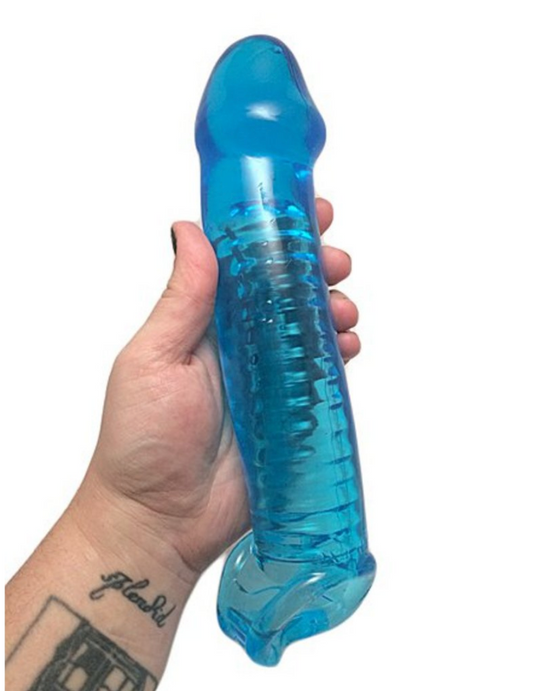A hand holding a blue, transparent, penis-shaped silicone toy with ridged interior