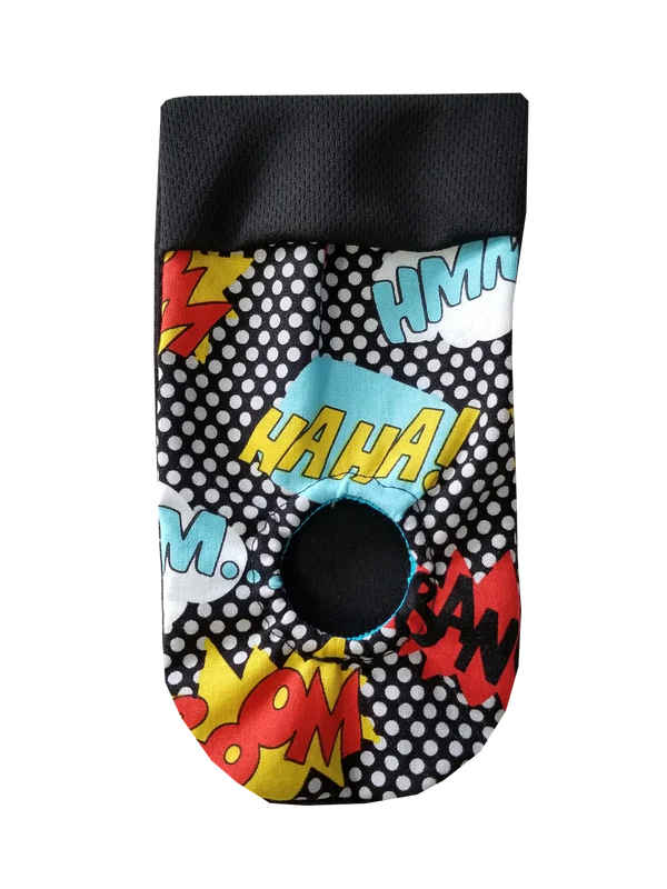 Colorful pop art jockstrap with comic-style text like "HAHA!" and "BAM!" in bright colors and patterns