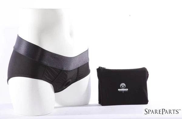 A mannequin wearing black O-ring underwear next to a black SpareParts pouch